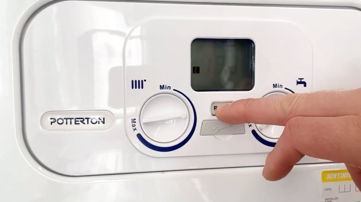 Close up of a boiler showing the settings and screen.